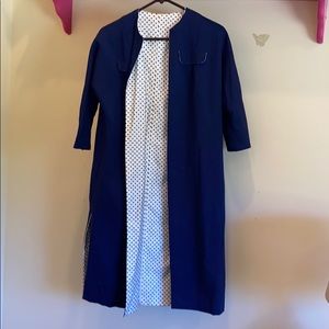 Navy blue half sleeve over coat.